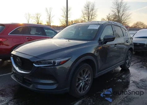 2021 Mazda Cx-5 Signature z USA, uszkodzony, nr VIN JM3KFBEY6M0358024